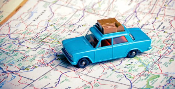 Car on map road-tripping on a summer math field trip