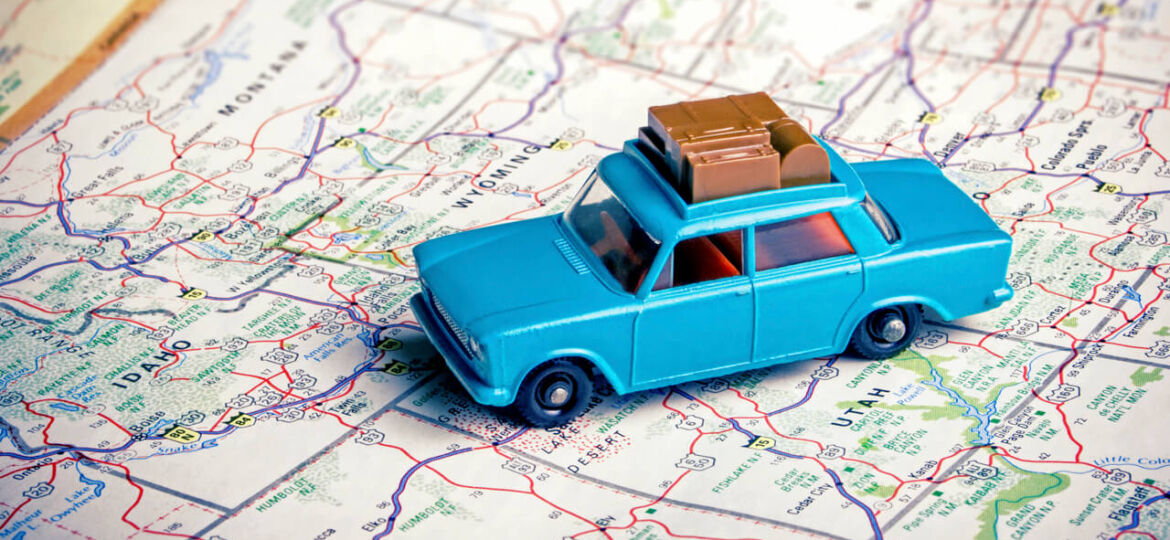 Car on map road-tripping on a summer math field trip