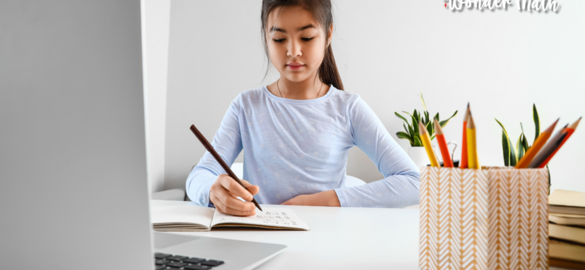 Young girl learning with a computer