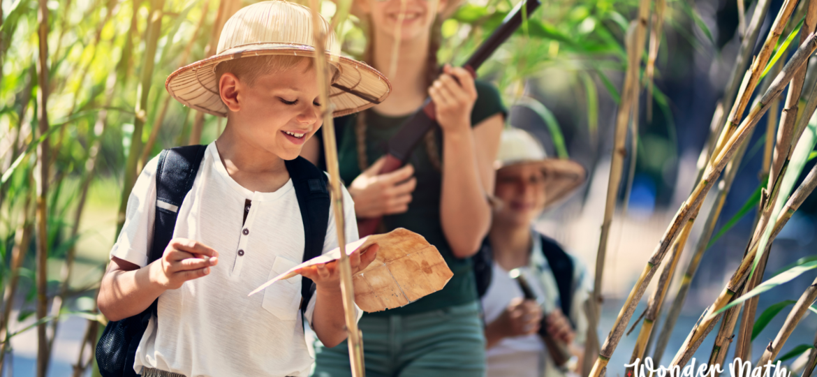 Picture of kids participating in a math-oriented treasure hunt, one of our summer fun math activities we recommend.