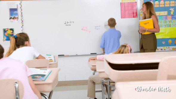 Wonder Math picture of child doing rigid math practice in a classroom for the article comparing Wonder Math & Russian School of Math.