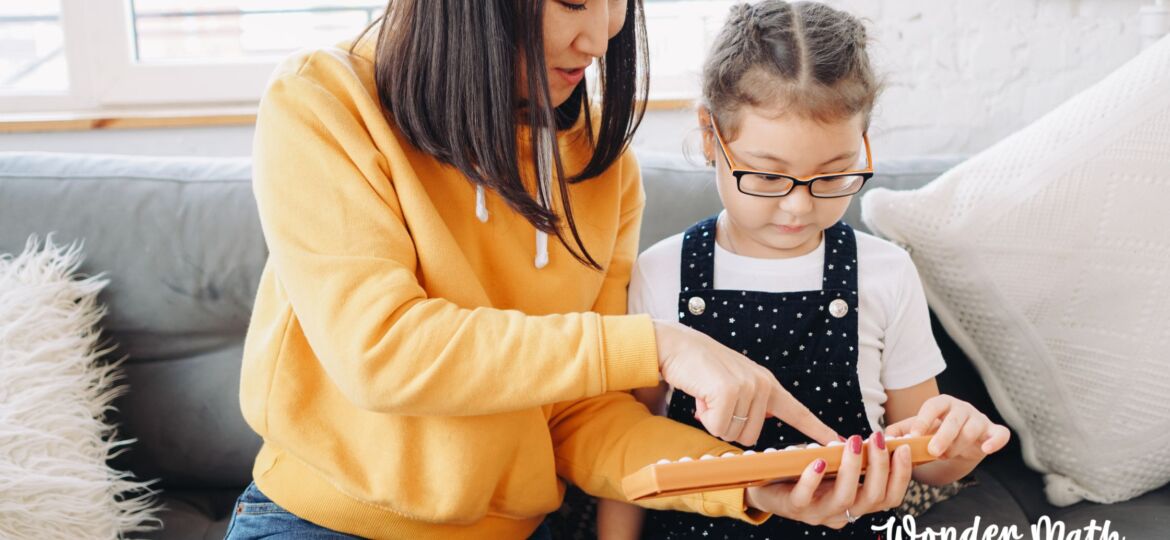 Mom helping her young child with math