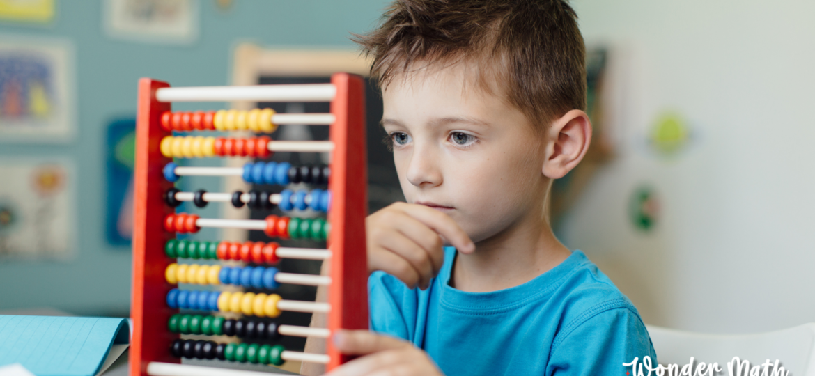 Young child contemplating a math problem and dealing with math anxiety.