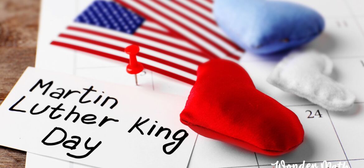 Martin Luther King Jr. Day on a card on top of a calendar with an American flag next to it.