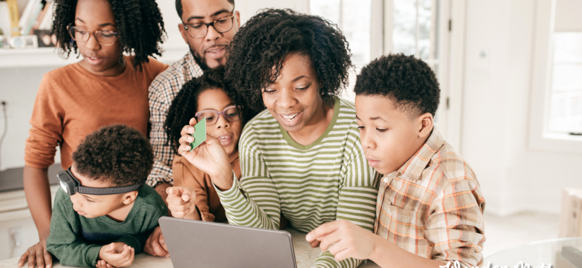 Family looking at an online learning platform like Outschool Classes or Wonder Math